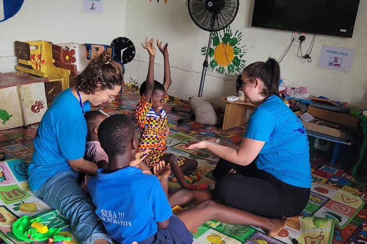 Shira (right) working with kids in Ghana