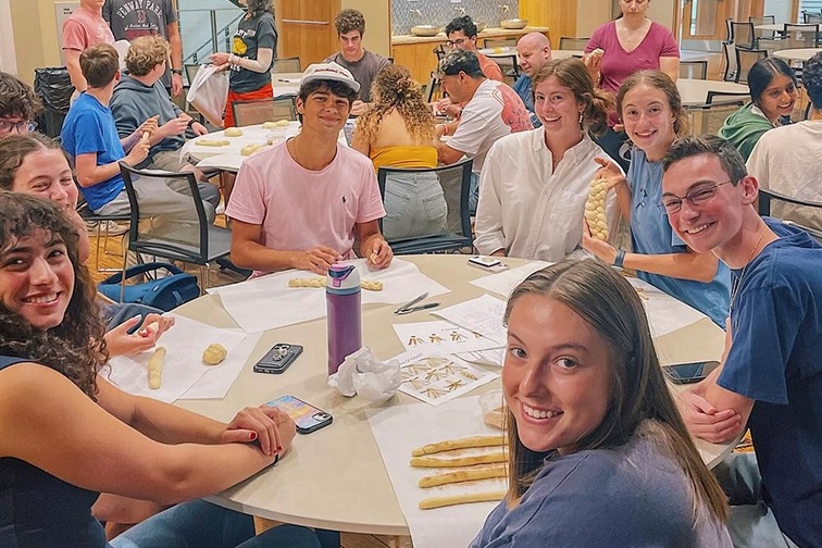 College students at a challah-braiding event